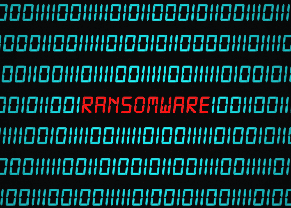 Ein dunkler Bildschirm, auf dem in Rot die Buchstaben Ransomware aufleuchten